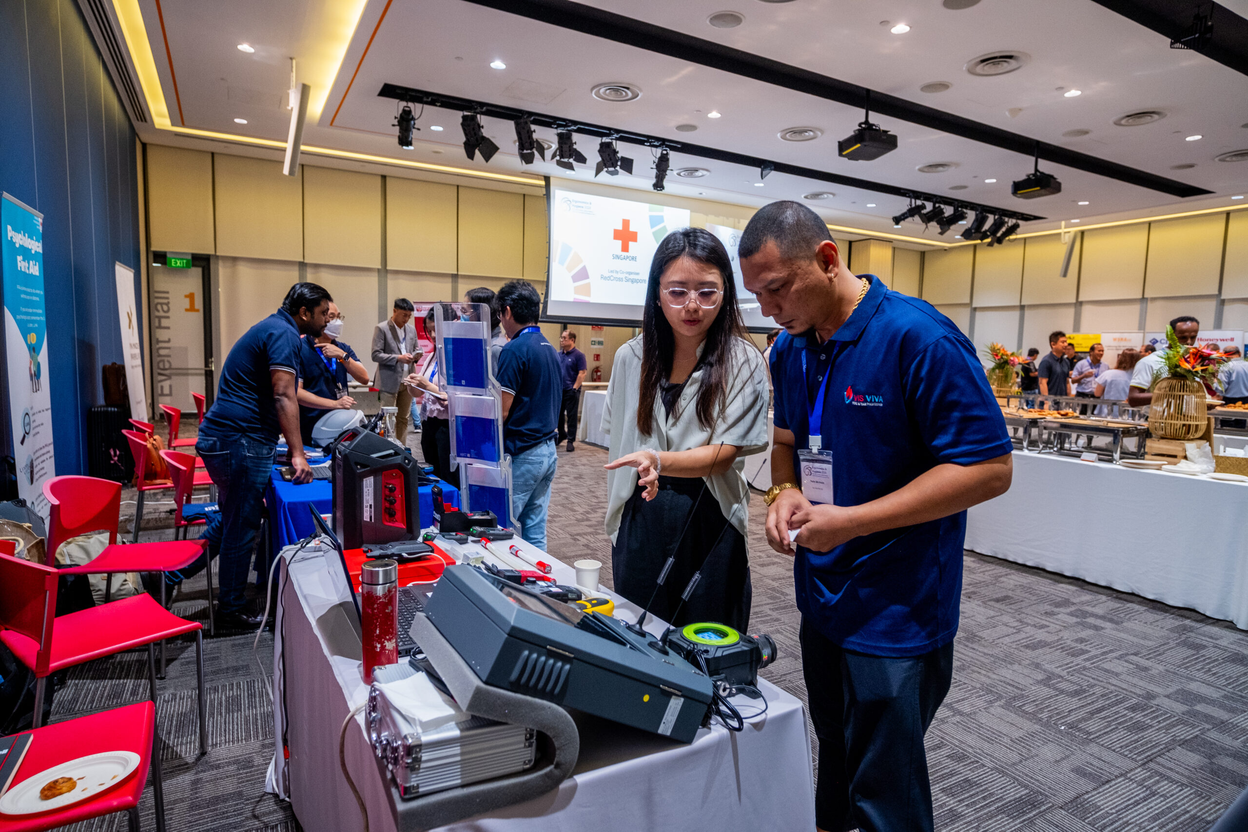 Delegates engaging with exhibition booths at a past EH Conference